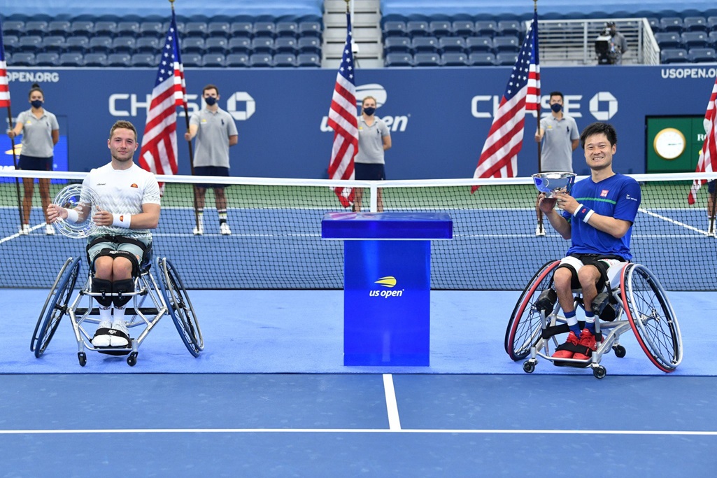 a picture of wheelchair tennis players Alfie Hewett and Shingo Kunieda following their mens singles final